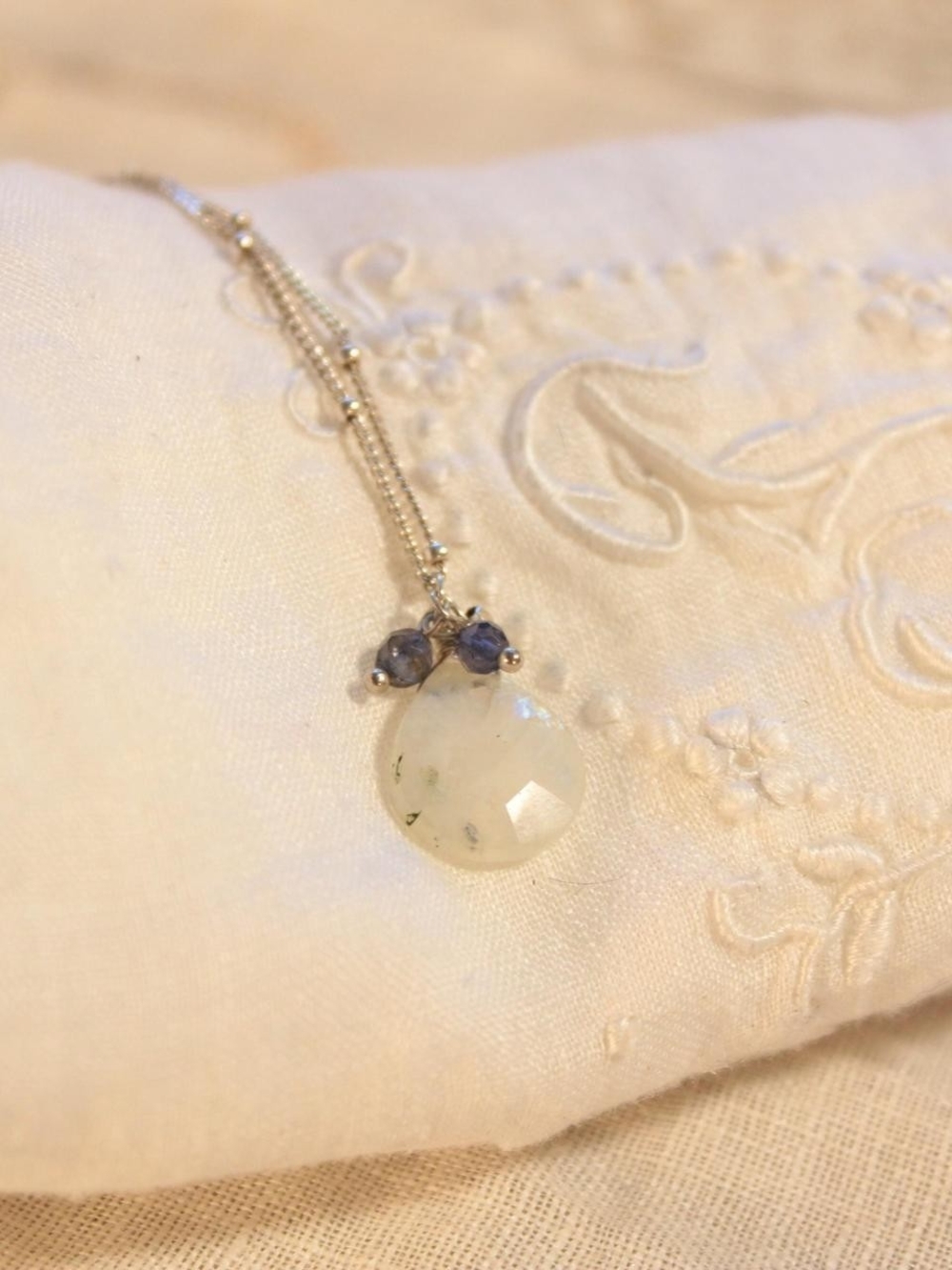 White Gemstone Pendant Necklace with Blue Accents